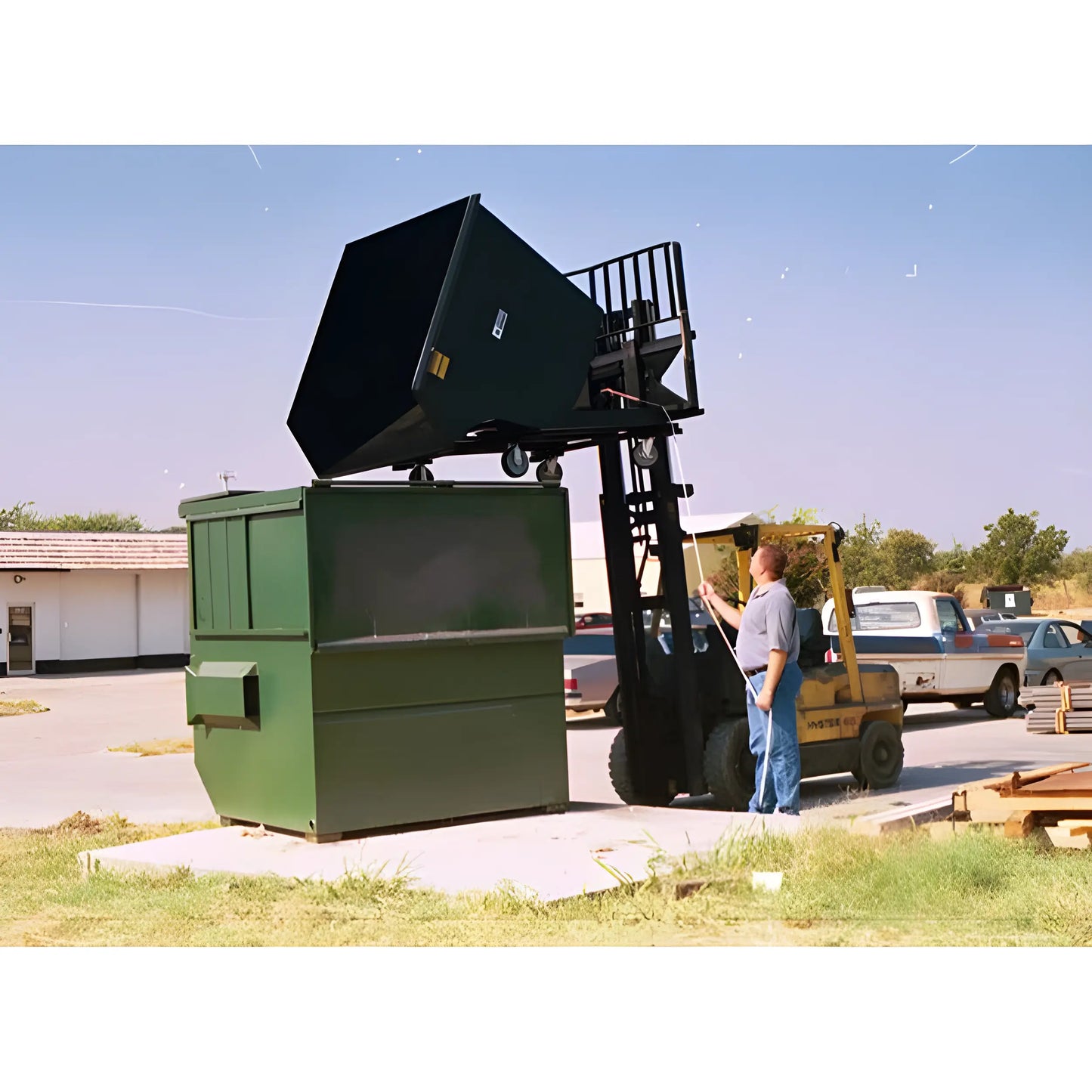 1.5 cuyd Self-Dump Hopper Dumping Outside