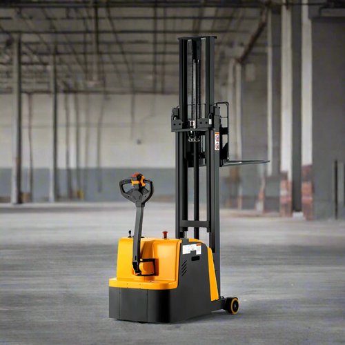 Yellow electric forklift in spacious warehouse with high industrial ceiling.