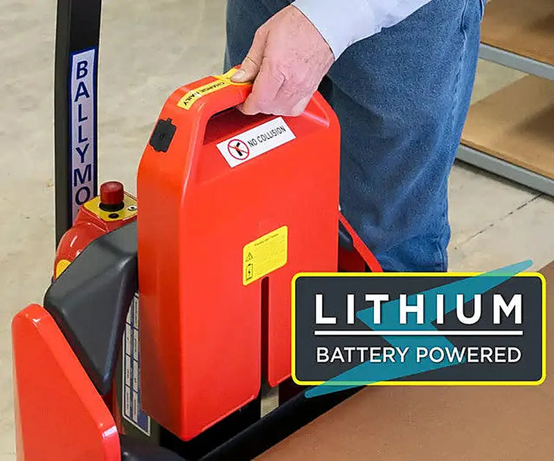 Person handling lithium battery pack for a powered pallet jack.