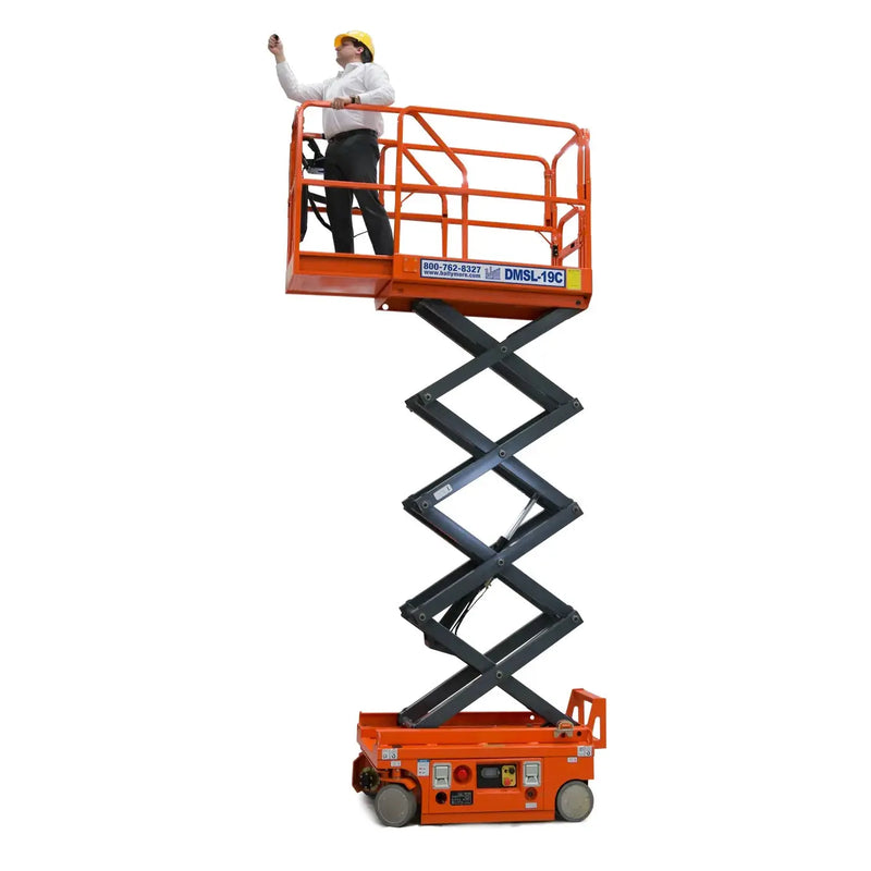 Ballymore drivable compact scissor lift in orange with an extended platform and person wearing a yellow hard hat