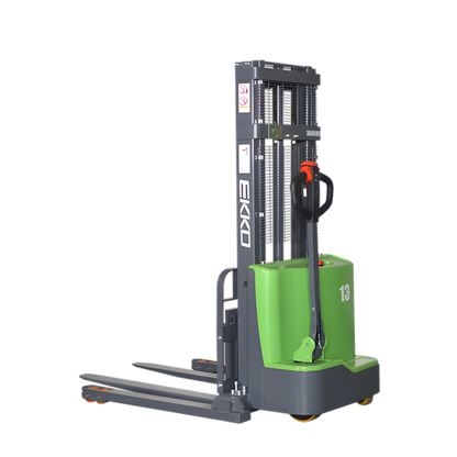 Side view of green EKKO straddle stacker with lifting forks.