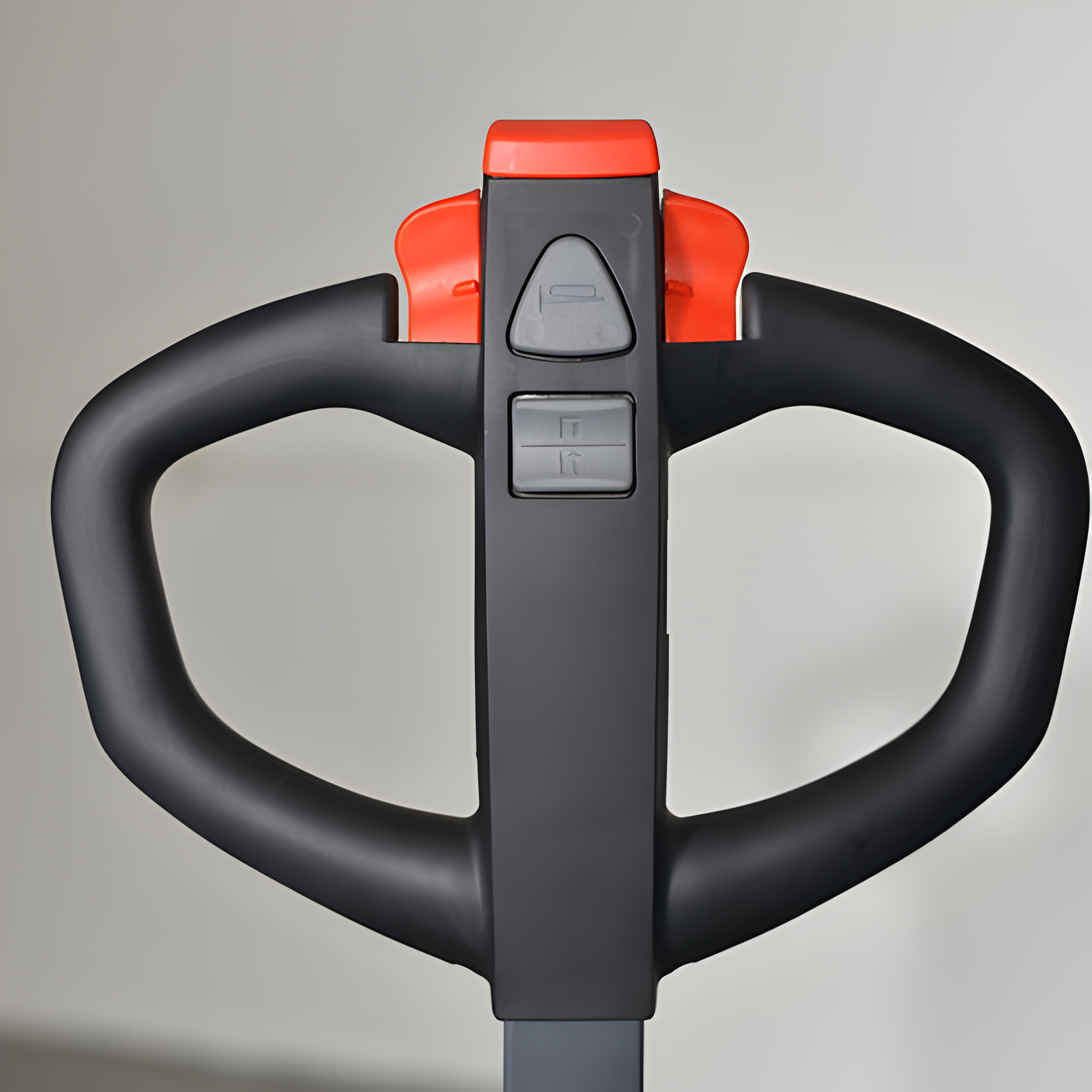 Close-up of black and red forklift handle with control buttons.