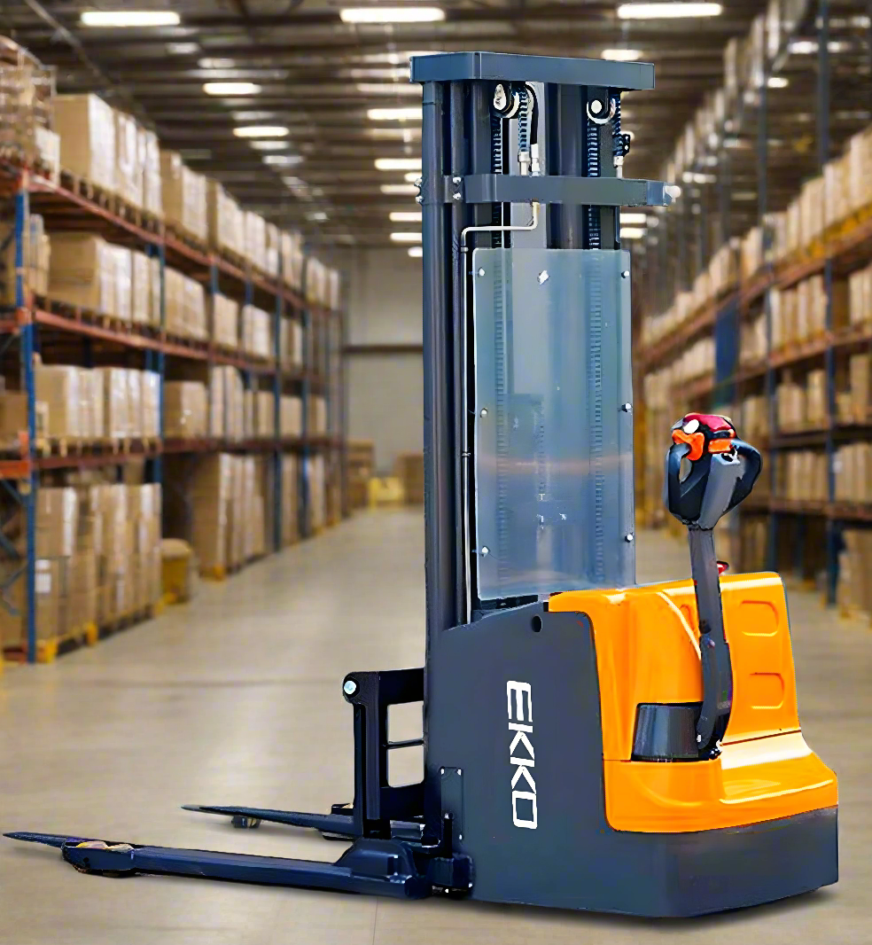 gray/yellow electric straddle stacker in a warehouse full of boxes