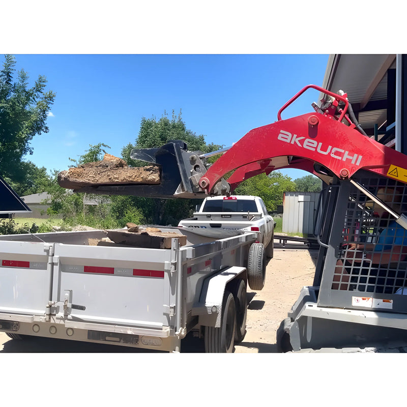 Star Industries 127 trailer being loaded with dirt using red Takeuchi loader outdoors near white truck