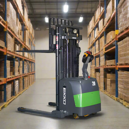 EKKO EB20CS-216Li electric pallet stacker in warehouse aisle with boxed inventory on shelves