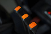 Close-up view of orange control levers inside an EKKO Electric Forklift cabin