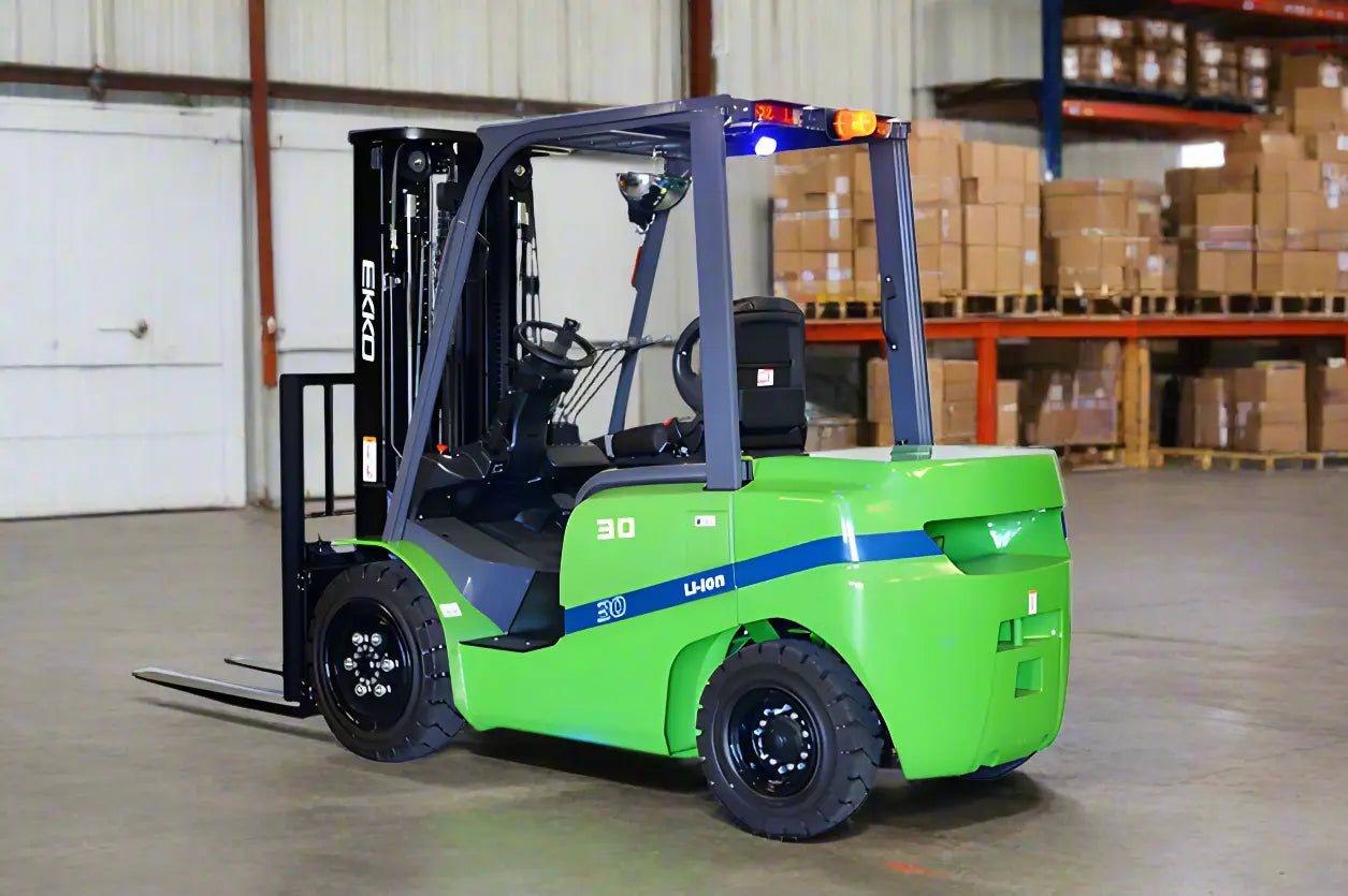 EKKO electric forklift in green and blue operating inside a warehouse with stacked boxes