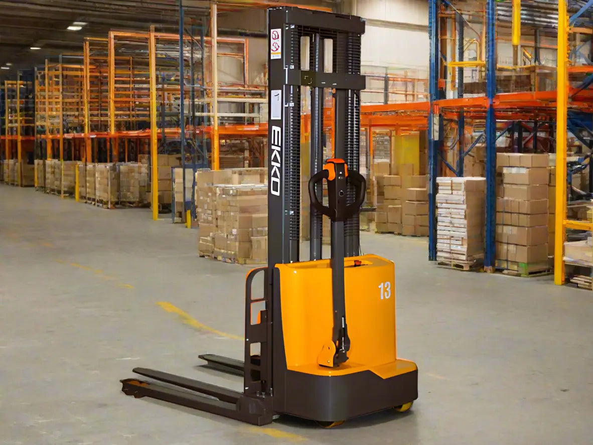 EKKO Electric Pallet Stacker in warehouse with orange and black design lifting pallets