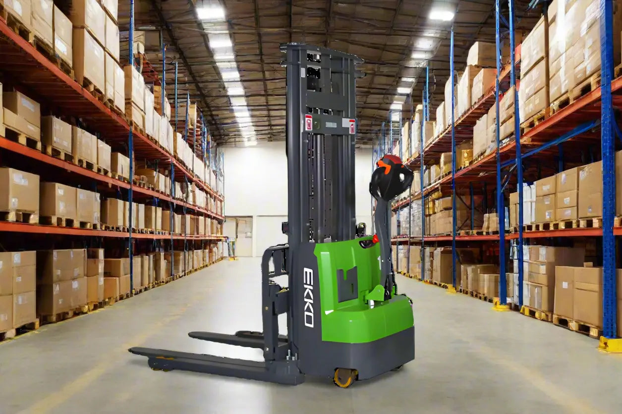 EKKO Electric Pallet Stacker in a warehouse aisle surrounded by shelves full of boxes
