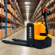 EKKO EP25E electric pallet jack in warehouse aisle with shelves stocked with boxes