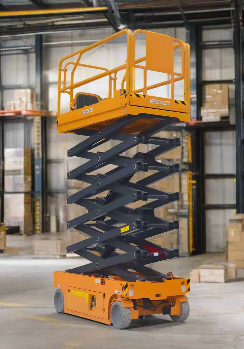 EKKO ES60E yellow scissor lift elevated inside warehouse with safety rails