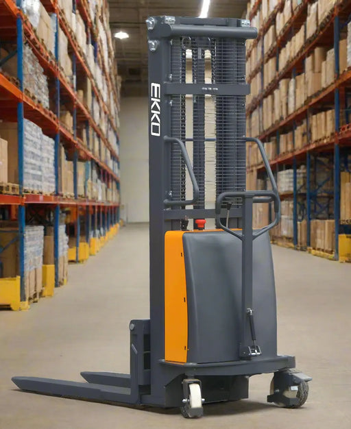 EKKO semi-electric pallet stacker in warehouse aisle with tall shelving and boxed inventory