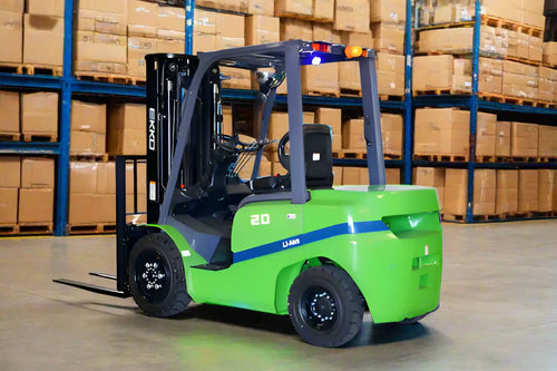 EKKO green electric forklift in warehouse with stacked boxes on shelves