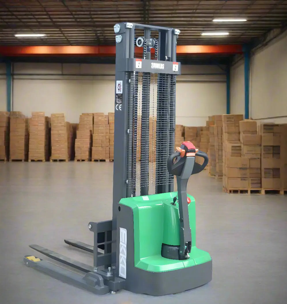 EKKO green Electric Pallet Stacker in warehouse with stacked cardboard boxes in background