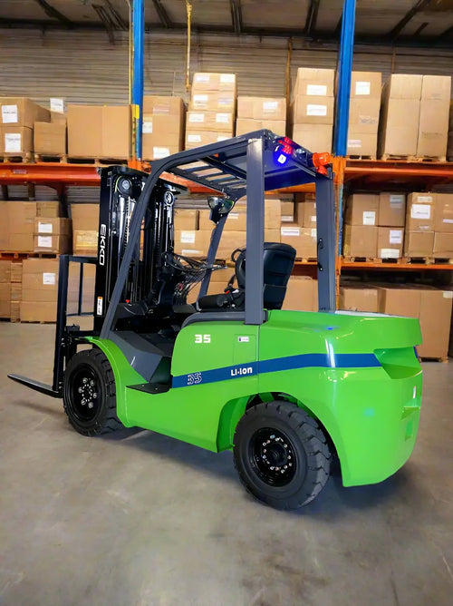 EKKO green Electric Forklift with Li-ion battery in warehouse with stacked cardboard boxes