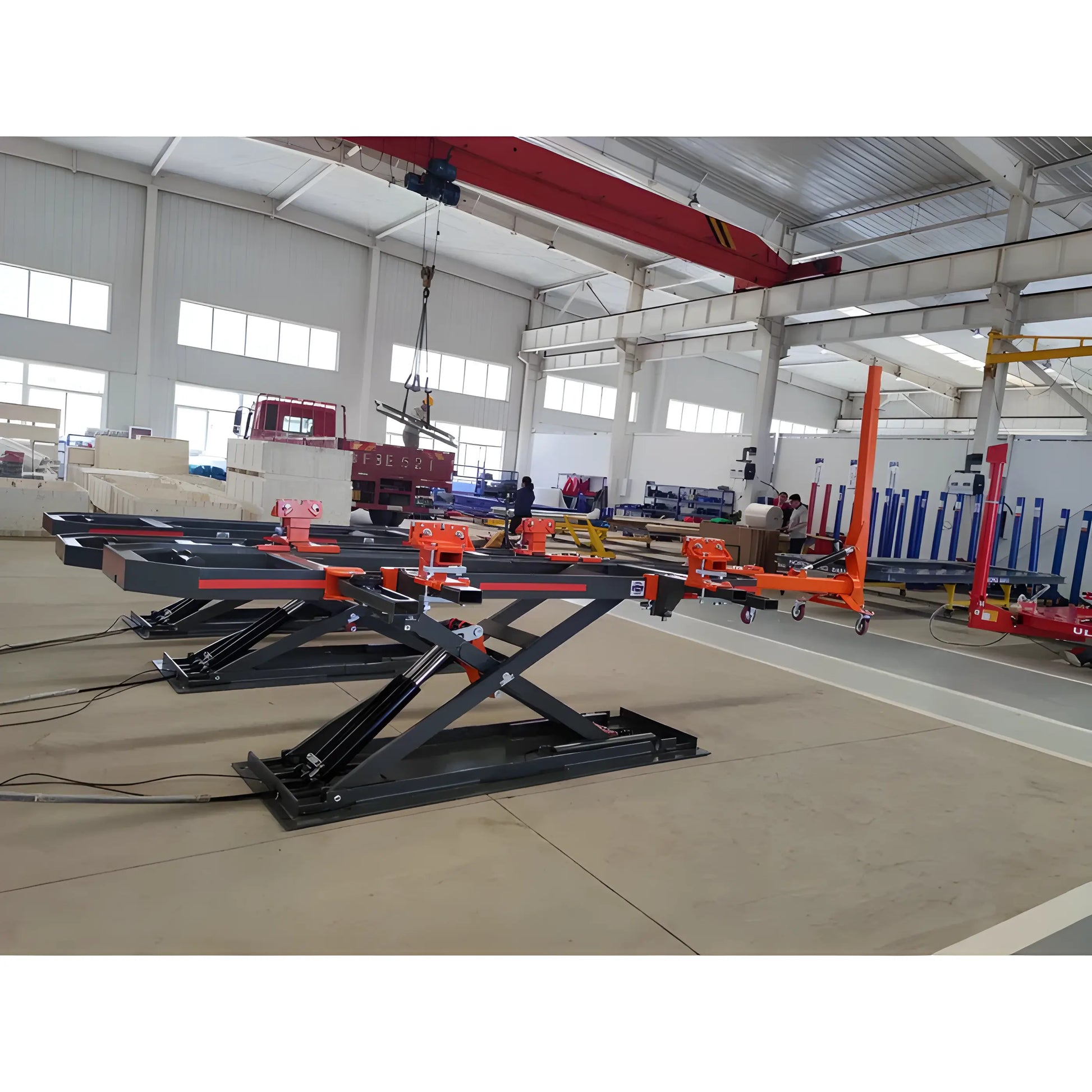 Katool Auto Body Frame Machine with hydraulic lifting system for vehicle repairs in a spacious workshop