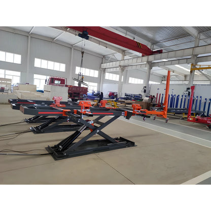 Katool Auto Body Frame Machine with hydraulic lifting system for vehicle repairs in a spacious workshop