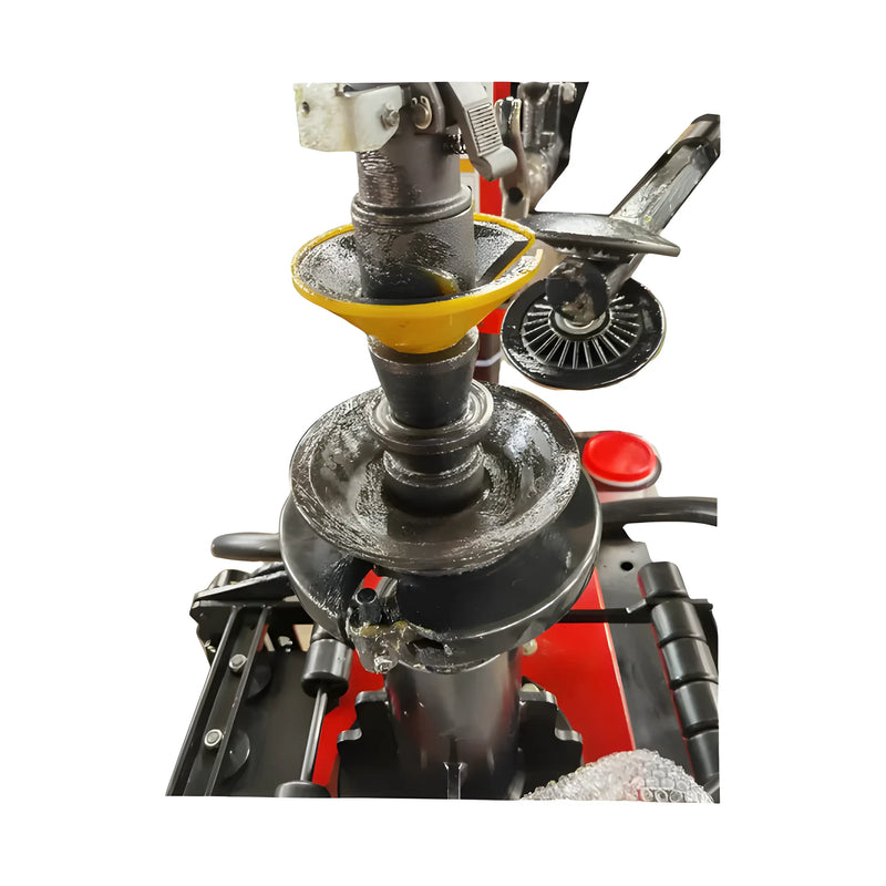 Close-up of Katool Tire Changer showing the bead breaker and mounting head features for efficient tire service