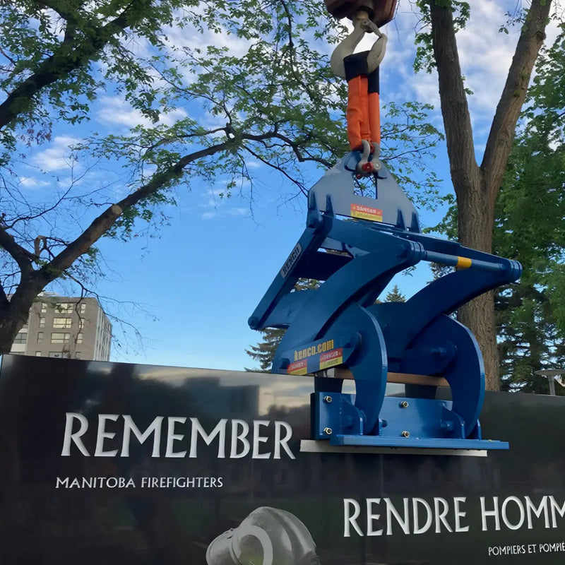 Kenco Concrete Barrier Lift in use lifting a concrete barrier at a construction site