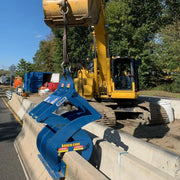 Kenco Concrete Barrier Lift attached to an excavator for efficient lifting and moving concrete barriers