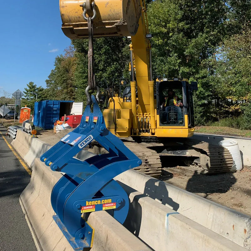 Kenco Concrete Barrier Lift attached to an excavator for efficient lifting and moving concrete barriers