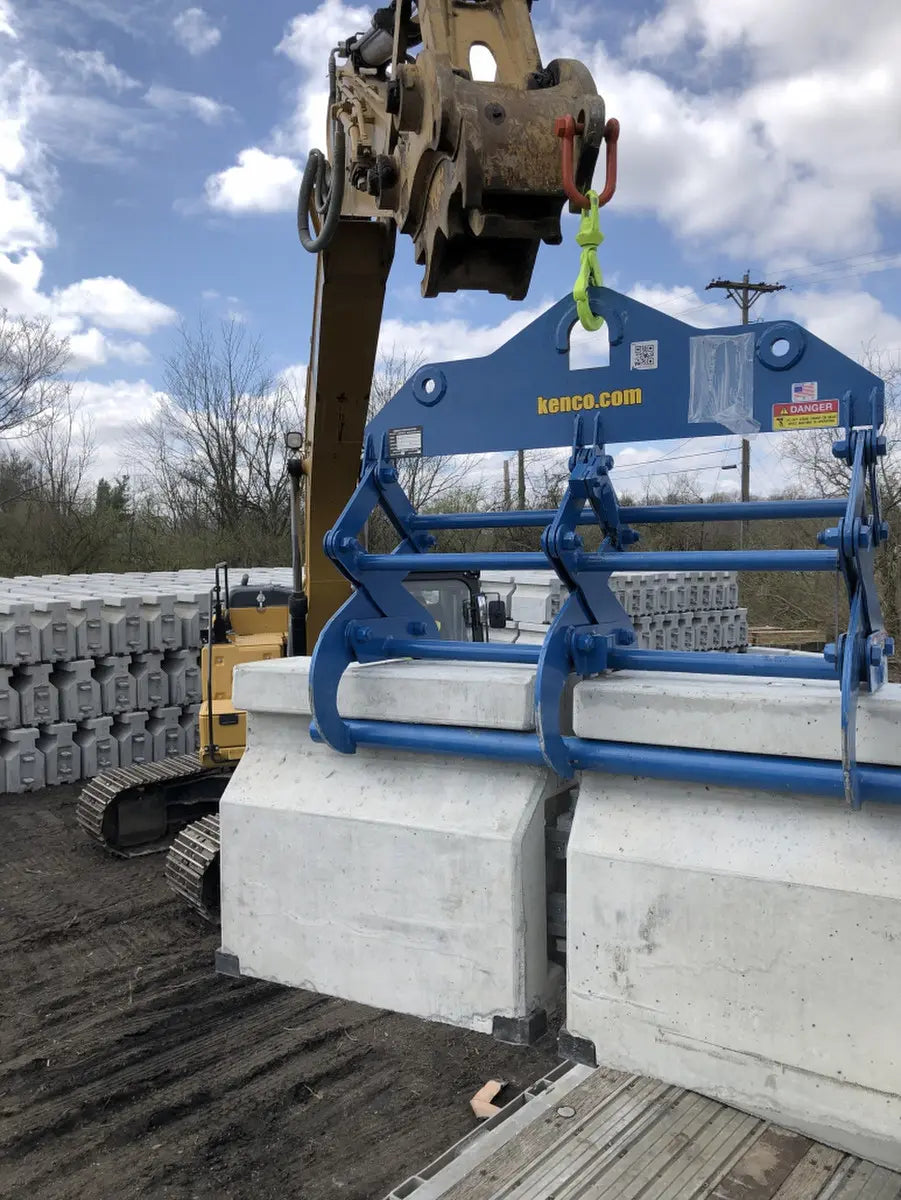 Kenco Lift Zipper Wall Lift being used to handle concrete barriers on a construction site