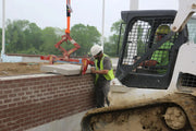 Kenco Multi-Lift Slab Lifting Clamp securely lifting a concrete slab on a construction site