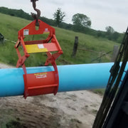 Kenco PL2750 Concrete Pipe Lift attached to a blue pipe in an outdoor setting