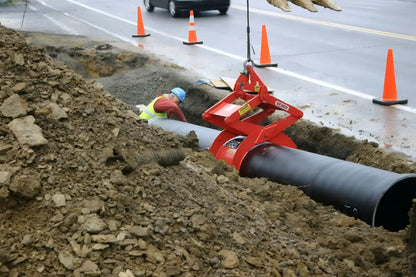 Kenco PL3000 Pipe-Lift in use for safely lifting large pipes at a construction site