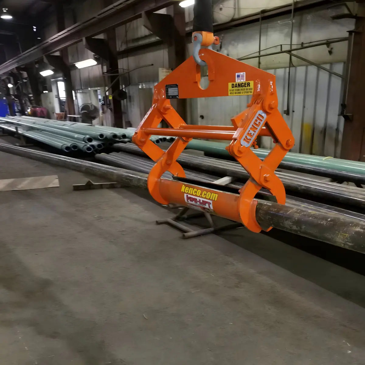 Kenco Secure & Versatile Pipe Lifter in an industrial setting lifting a large pipe