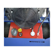 Close-up of Makinex 1212-23kW 480V industrial equipment showing fan and control panel with tires in background