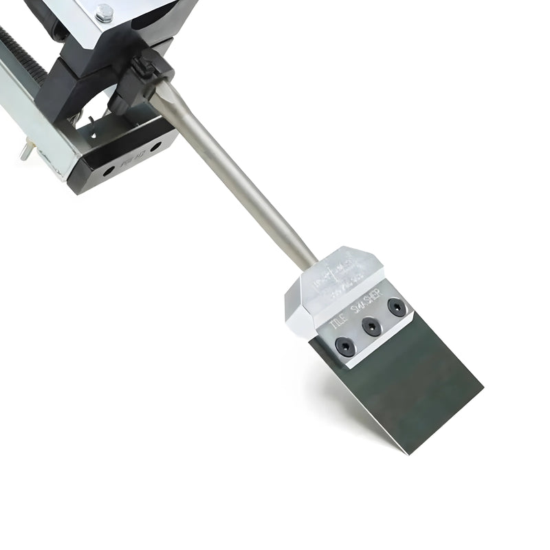 Close-up of Makinex TSHC-SS-US-V2 heavy-duty steel scraper tool with sharp blade and mounting bracket