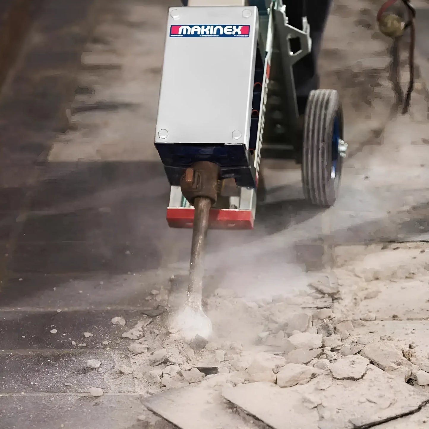 Makinex WCUS-420 heavy-duty floor breaker machine chipping concrete surface with dust