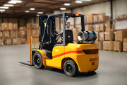 EKKO propane forklift in yellow and black inside warehouse with cardboard boxes in background