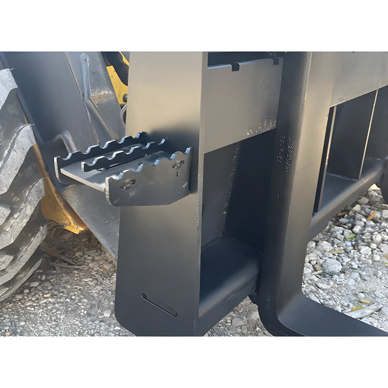 Close-up of the Star Industries 110EC-ITA heavy equipment attachment showing metal steps and tire on gravel surface