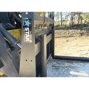 Close-up of Star Industries 110EC-ITA heavy-duty loader attachment with metal frame and hydraulic parts