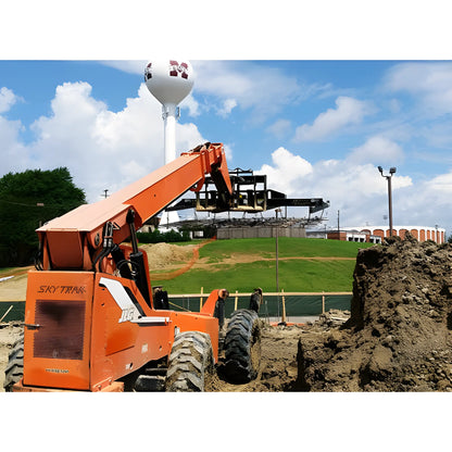Star Industries 1155 1155-36CCFP 1155-24CCFP orange SkyTrak telehandler lifting materials at construction site