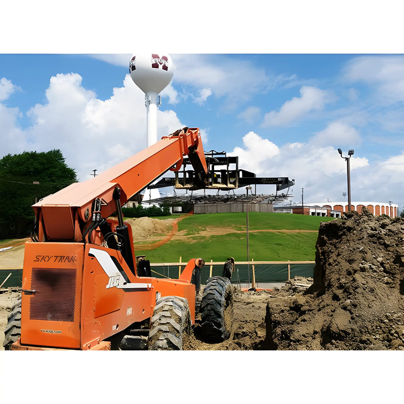 Star Industries 1155 1155-36CCFP 1155-24CCFP orange SkyTrak telehandler lifting materials at construction site