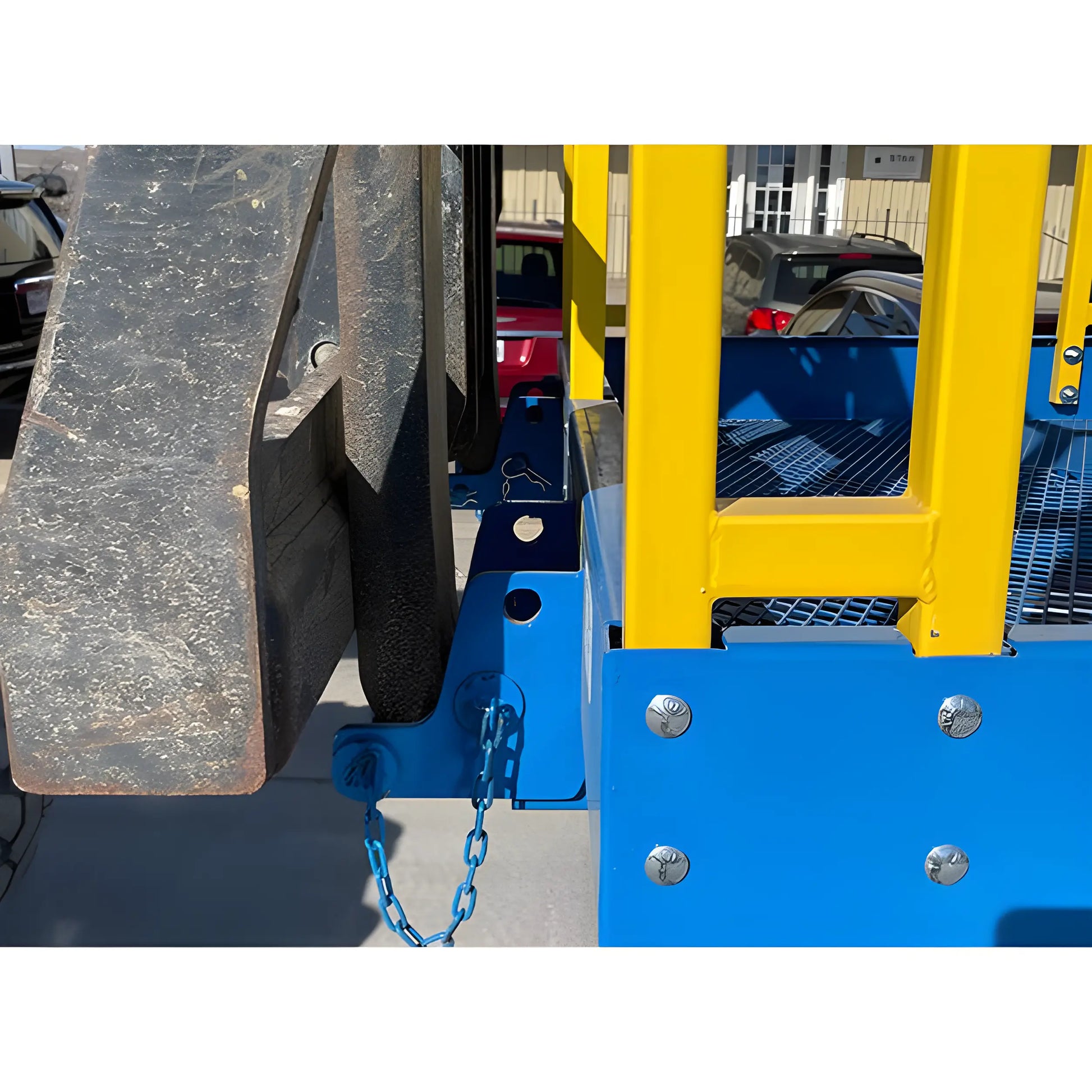 Close-up view of Star Industries 1206C blue and yellow heavy-duty equipment hitch connection