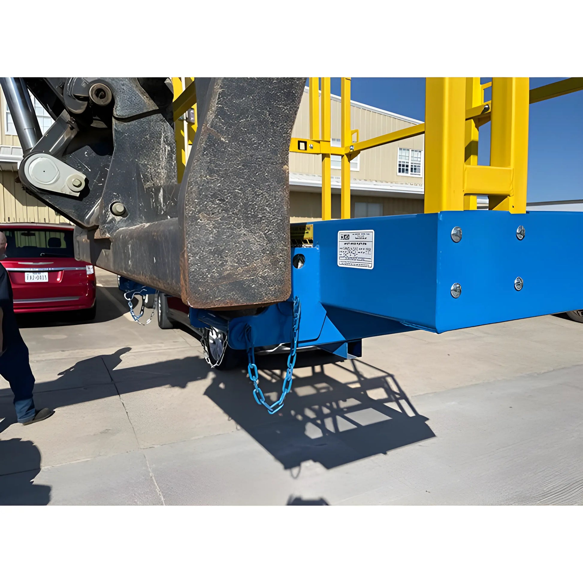 Star Industries 1208C blue and yellow heavy-duty lift platform attached to machinery outdoors