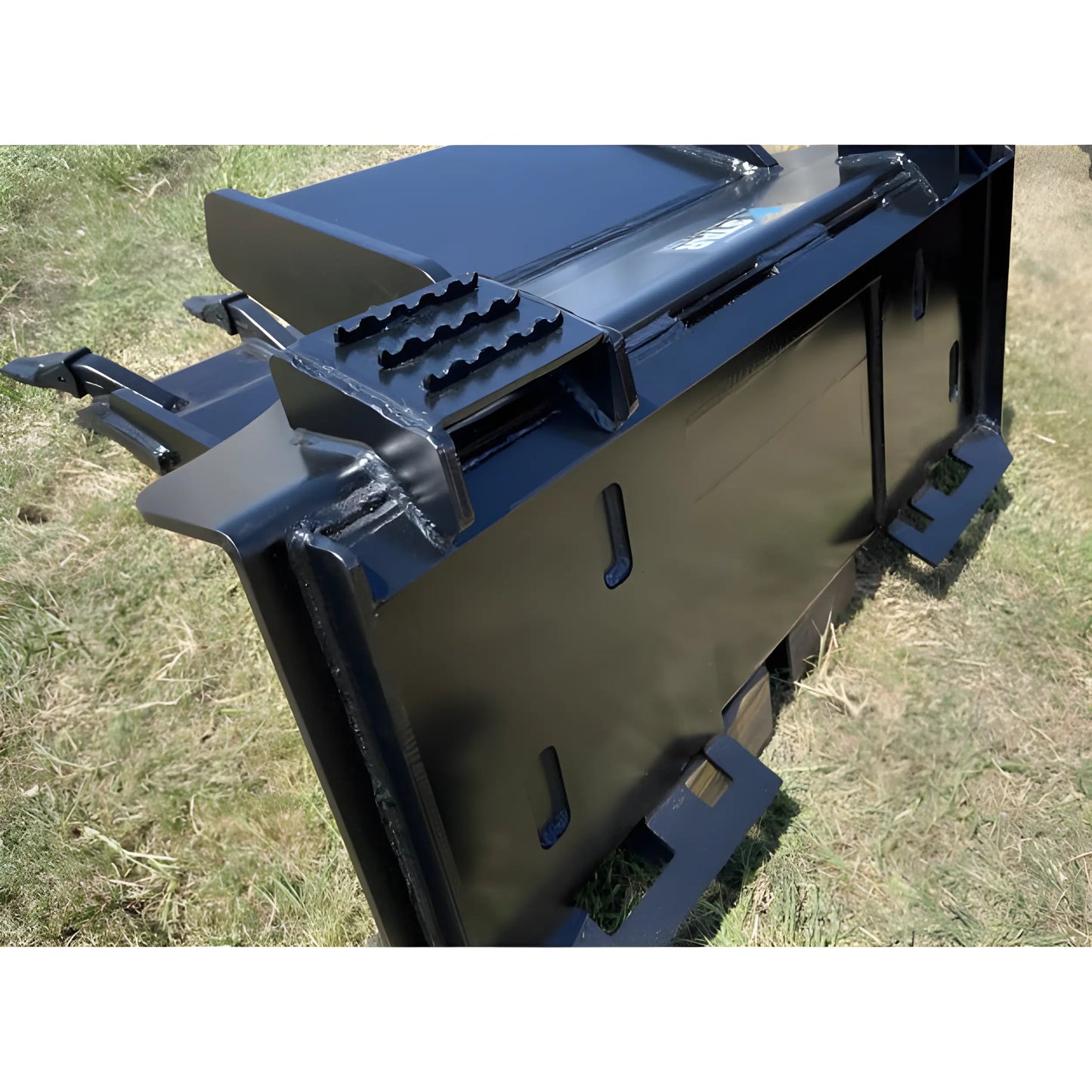 Star Industries 127 heavy-duty black metal attachment for industrial machinery on grass background
