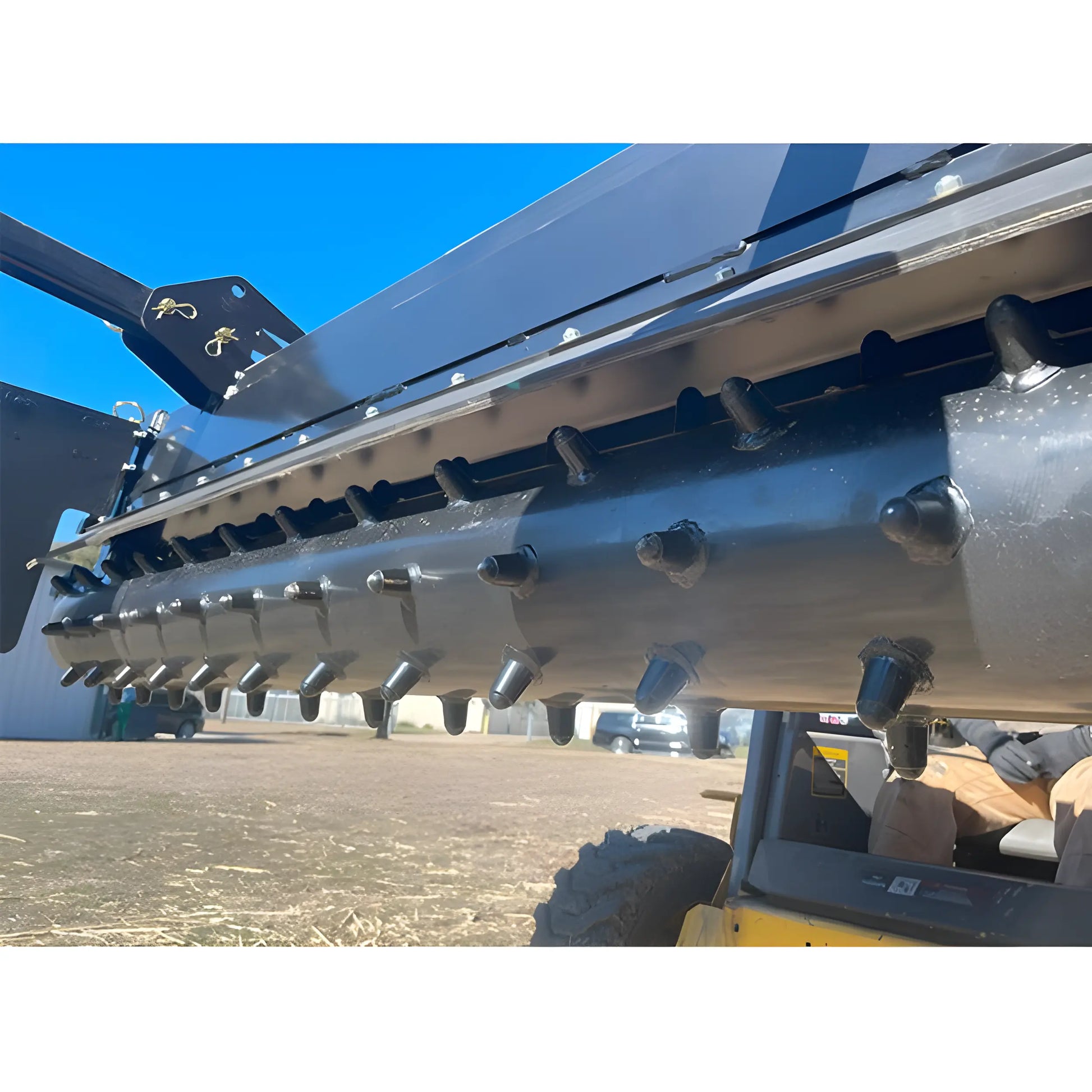 Close-up of Star Industries 130-72 heavy-duty black agricultural equipment with rotary cutting teeth