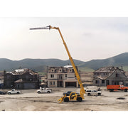 Star Industries 1325 yellow telescopic boom lift operating at a residential construction site with houses and vehicles