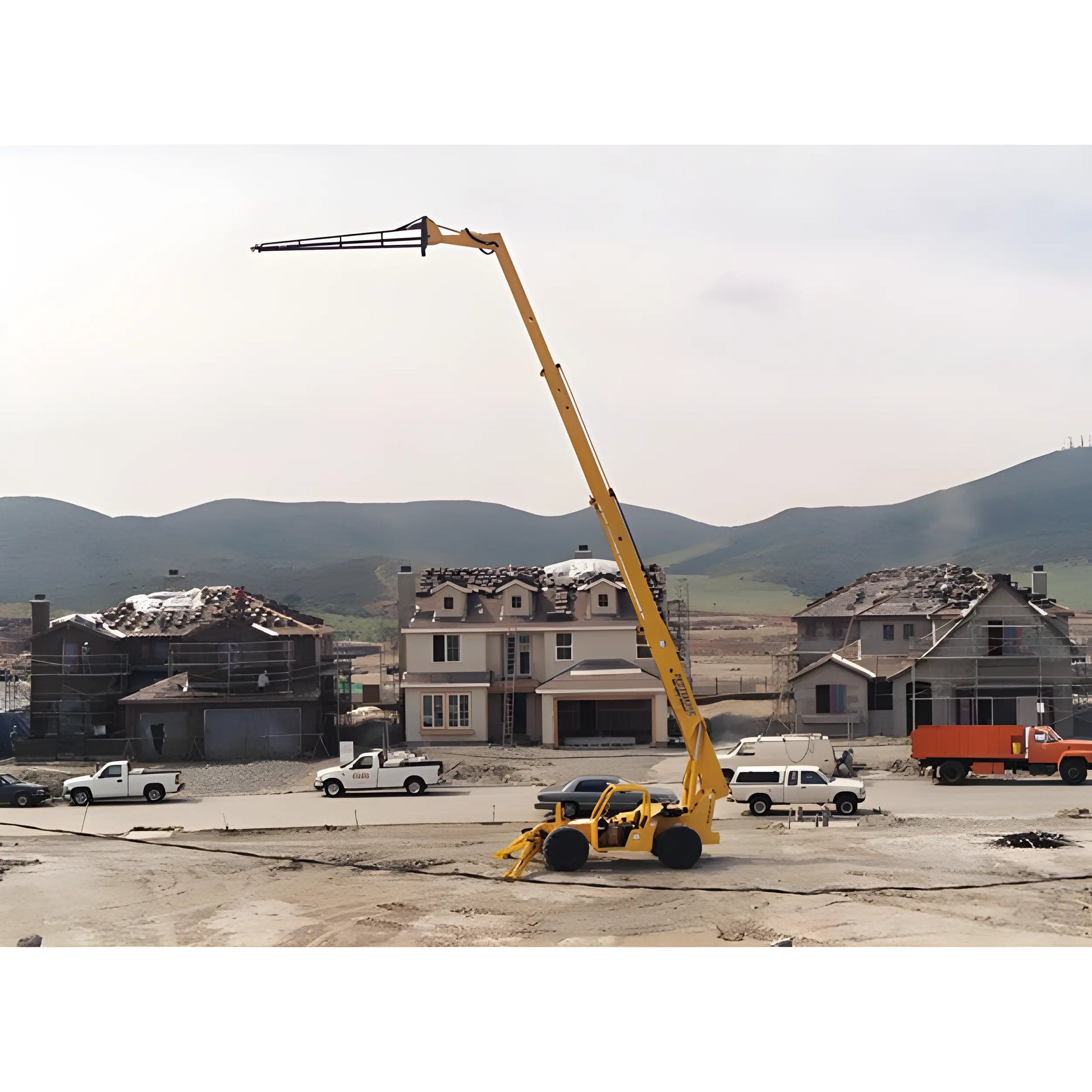 Star Industries 1330 telescopic boom lift at construction site with residential houses and trucks in background