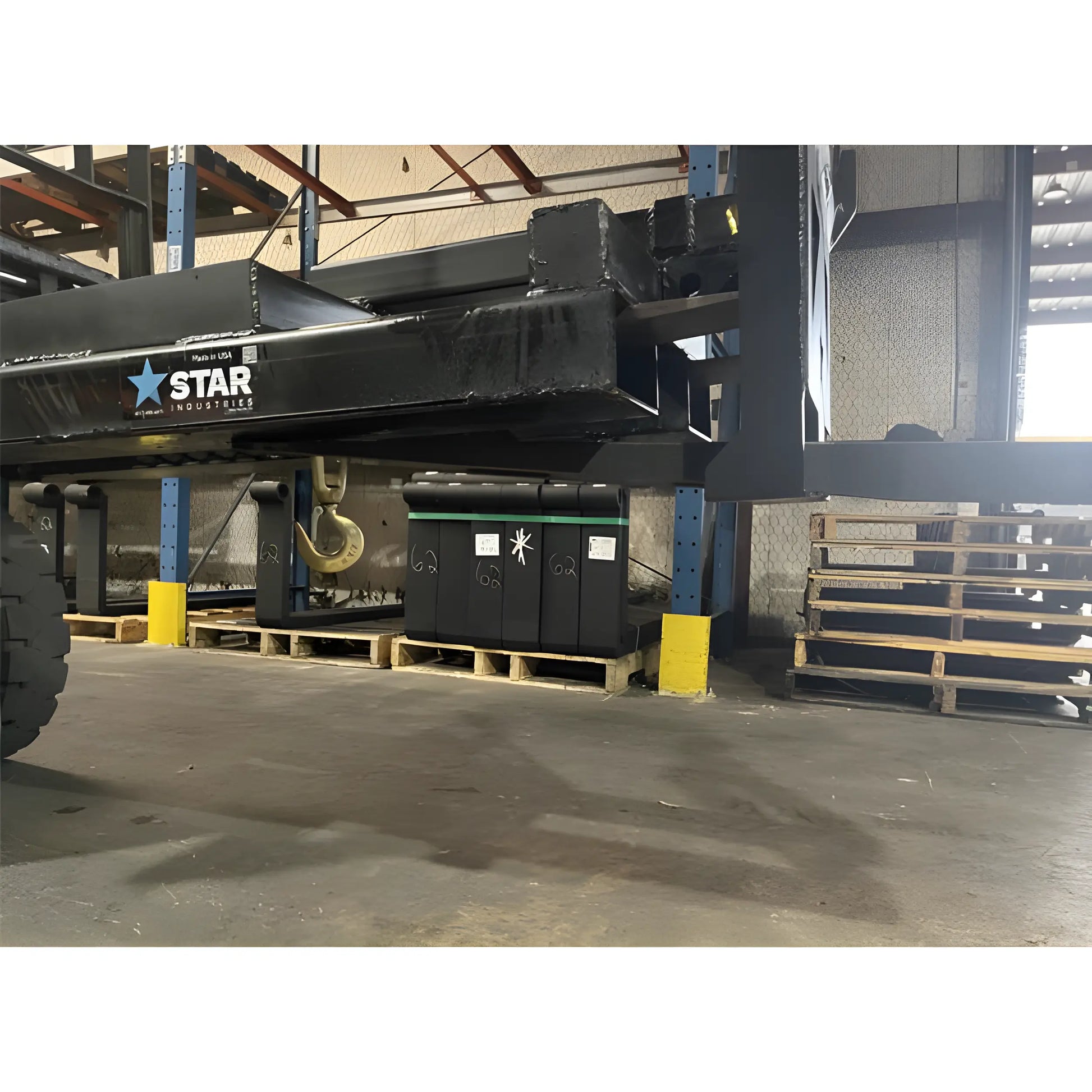 Star Industries 1390-FM heavy-duty black industrial equipment arm in warehouse setting