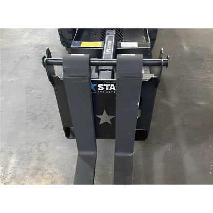 Star Industries 1390-FM forklift attachment with heavy-duty steel forks on concrete floor
