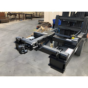 Heavy-duty forklift attachment Star Industries 1390B in black metal with securing chains on concrete floor
