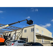 Star Industries 1420 1425 1430 forklift boom lifting bucket near industrial warehouse under clear blue sky