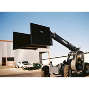 Star Industries 1420 1425 1430 heavy-duty forklift lifting large black container outside warehouse