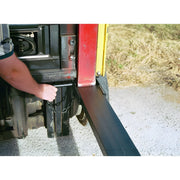 Hand adjusting the loading lift on a Star Industries 1664 truck liftgate in outdoor setting
